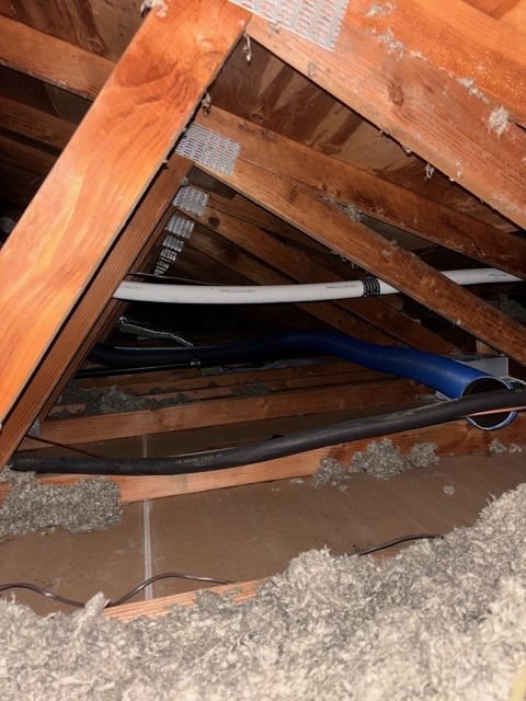 Before: thin, dirty insulation and open wiring penetrations