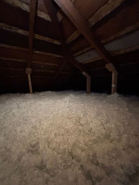 Finished attic, cellulose leveled to depth across the joists